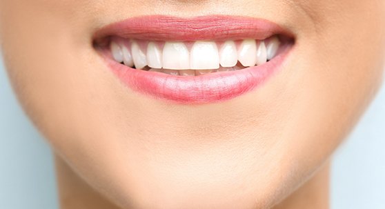 Close-up of a woman showing off her smile