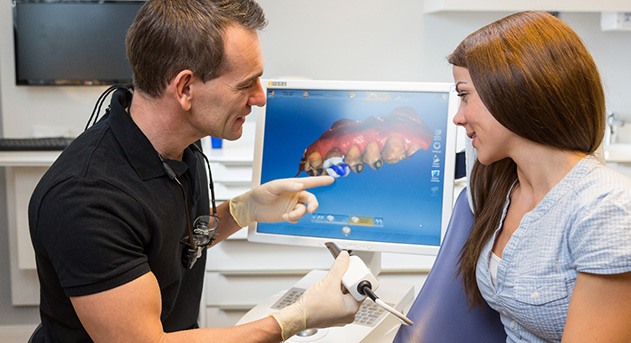 dentist explaining CEREC crown