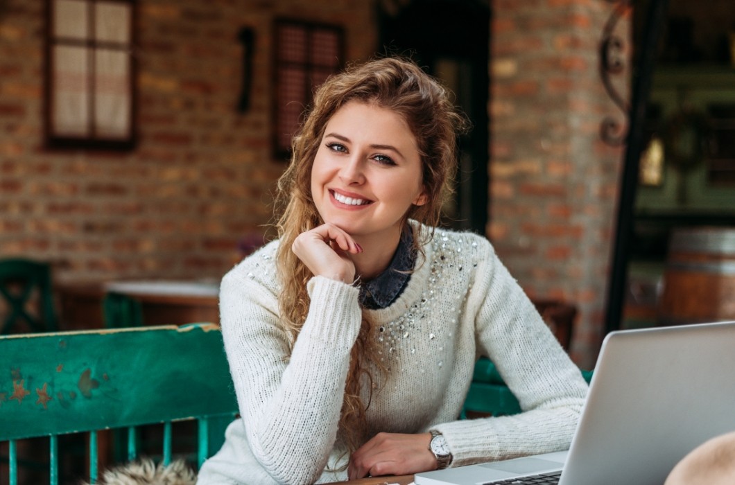 Woman sharing flawless smile after cosmetic dentistry