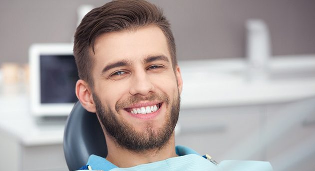 A lab worker making dental crowns