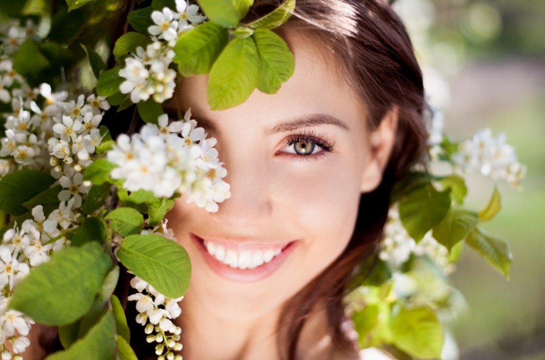 Woman with healthy smile after gum disease treatment