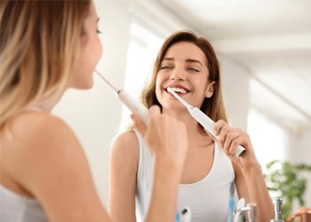 Woman holding a toothbrush