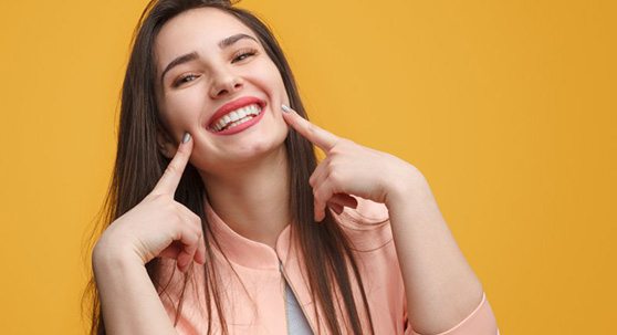 Lady shows off pretty smile?