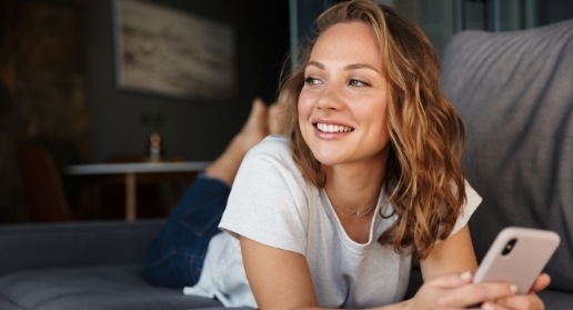 Woman with healthy smile after gum disease treatment