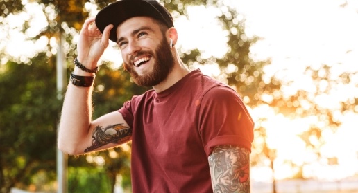 Man with full smile after replacing missing teeth