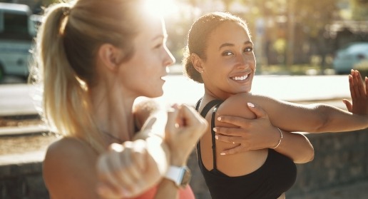 Two women smiling after cosmetic dentistry