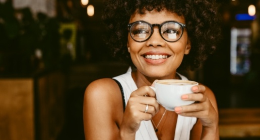 Woman smiling after Invisalign orthodontic treatment