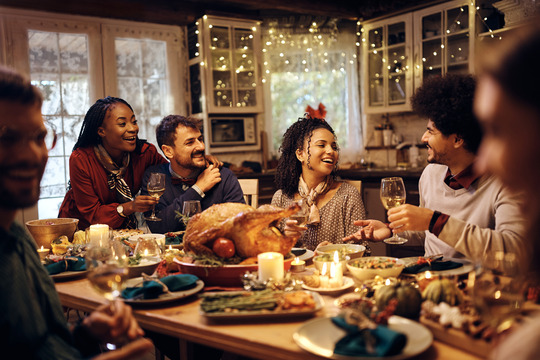 friends and family eating Thanksgiving 